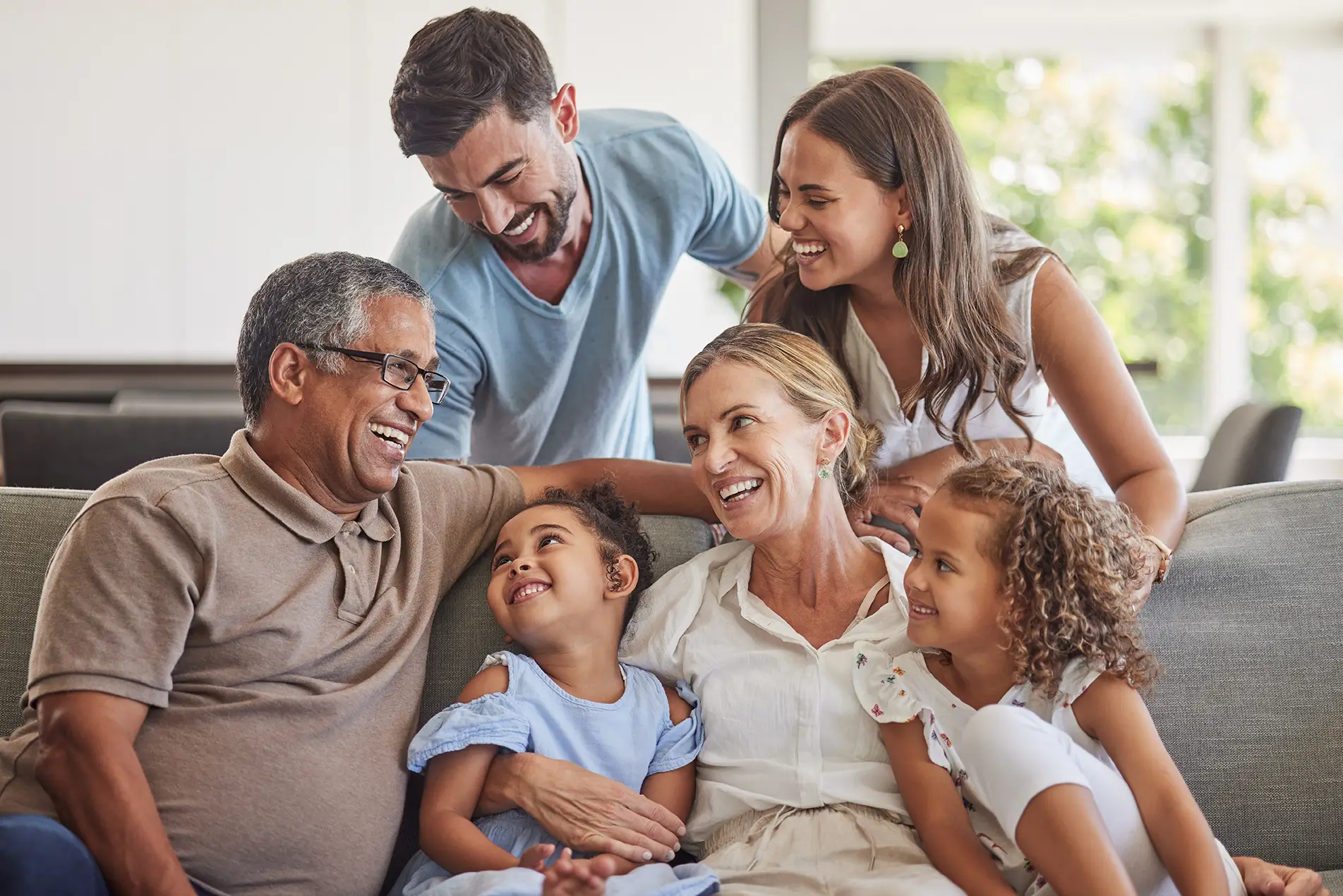 Happy multigenerational family at home, representing investment management and portfolio planning in Spring, TX.