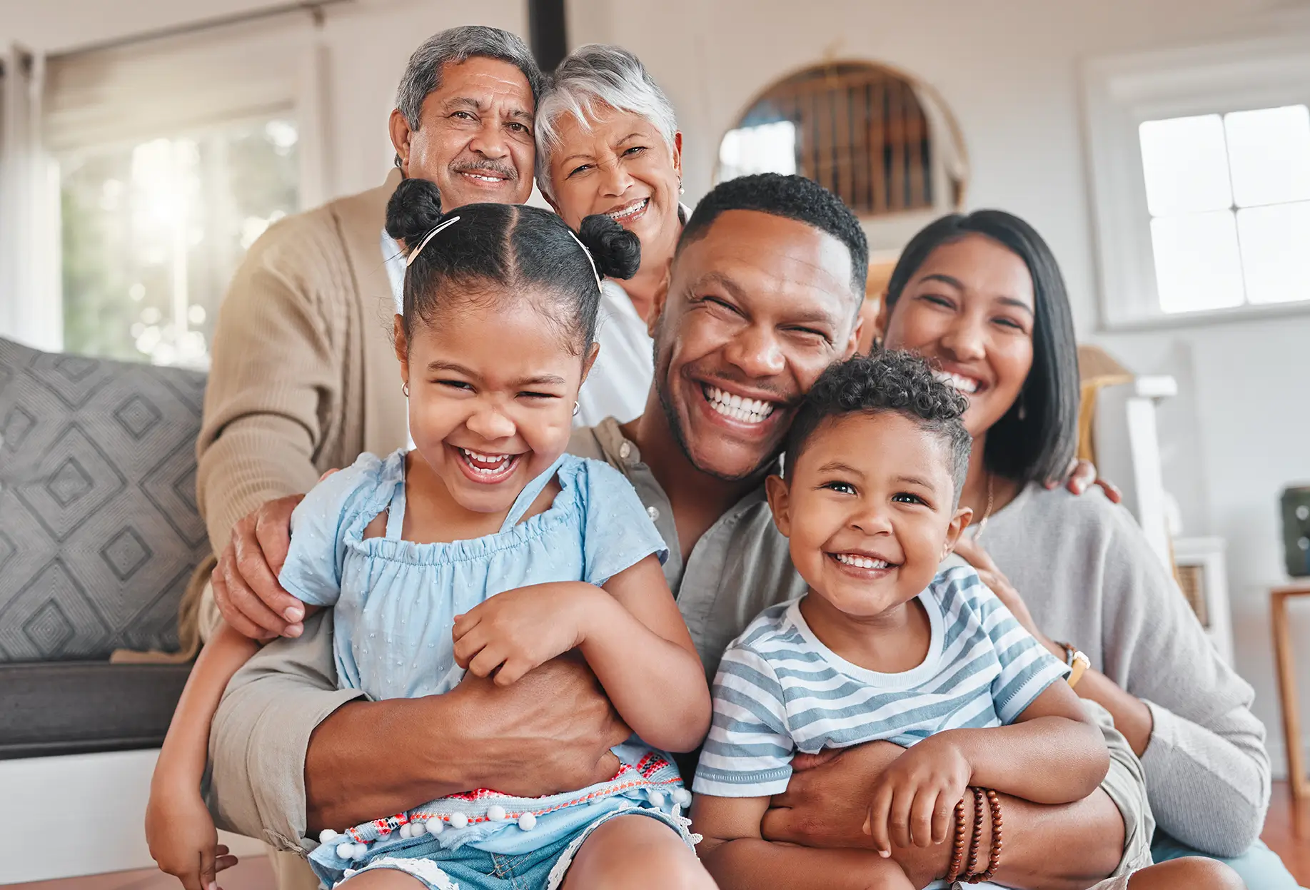 Happy multigenerational family at home, representing investment management and portfolio planning in Spring, TX.