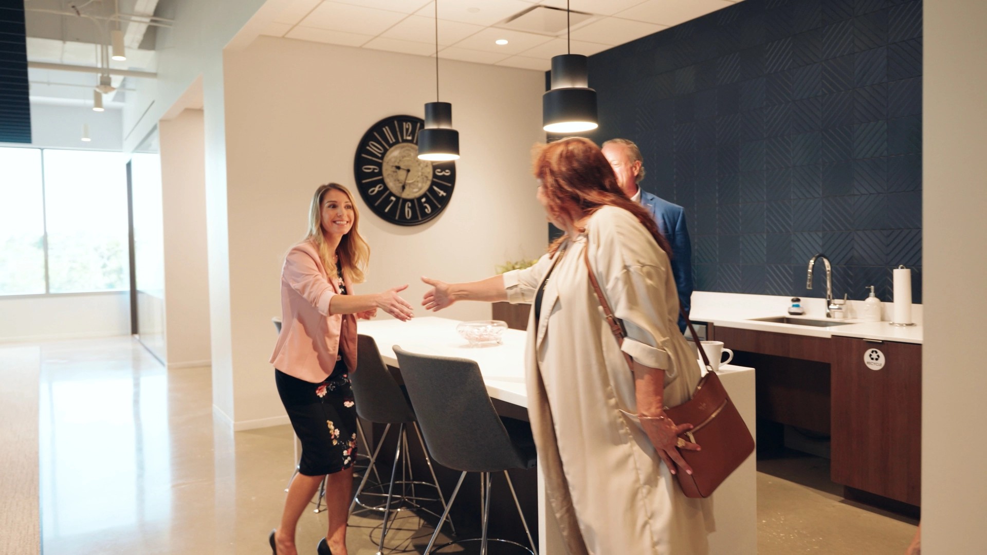 Retirement planning advisor welcoming clients for a personalized consultation