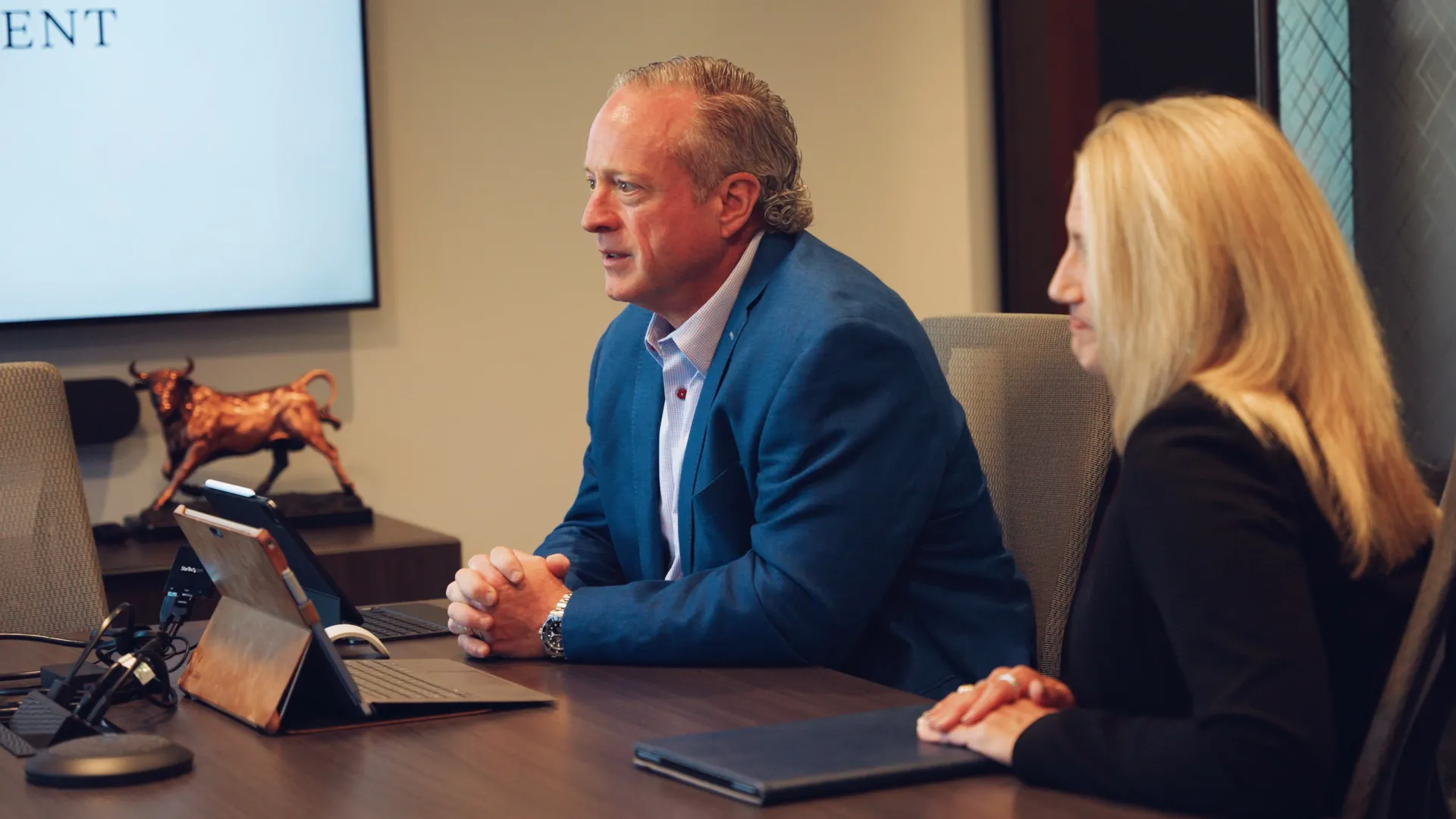 Retirement planning professionals discussing strategies to support long-term financial confidence